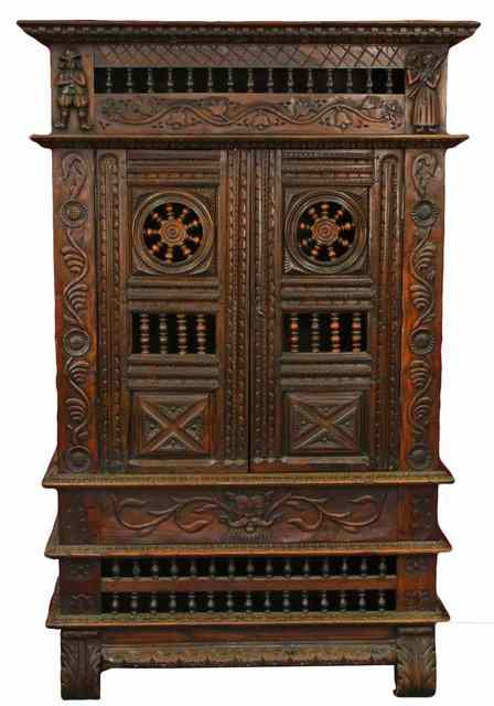 Appraisal: An early th Century walnut armoire with carved cornice and