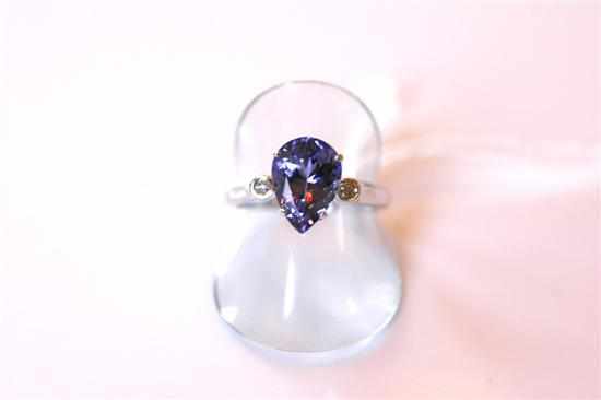 Appraisal: A TANZANITE AND DIAMOND RING IN CT WHITE GOLD TOTAL