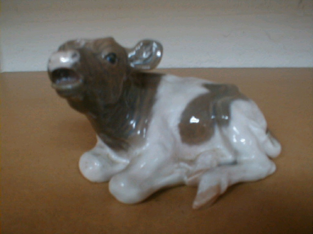 Appraisal: A Royal Copenhagen seated cow