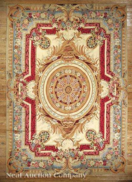 Appraisal: An Aubusson Carpet cream ground central stylized floral medallion foliate