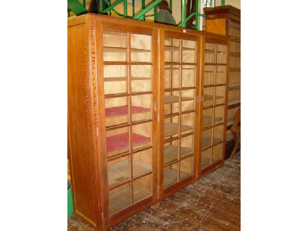 Appraisal: A Betty Joel oak bookcase display cabinet enclosed by glazed