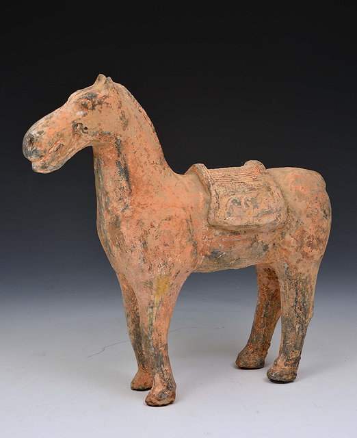 Appraisal: A CHINESE PAINTED POTTERY HORSE with traces of red pigment