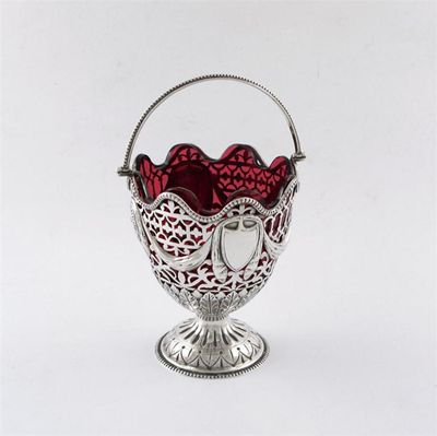 Appraisal: A late-Victorian silver swing handled sugar basket tapering circular form