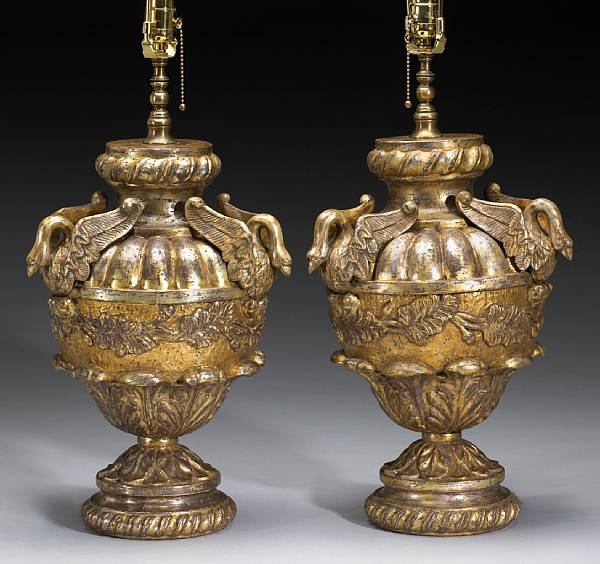 Appraisal: A pair of Italian Neoclassical style silver giltwood urns modern