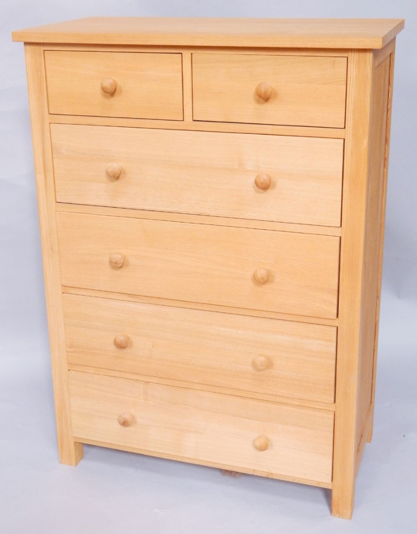 Appraisal: A light oak chest of two short over four long