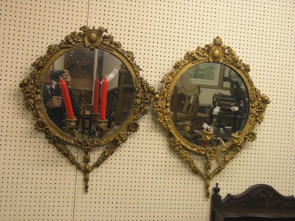 Appraisal: A pair of girandoles circular-shape in gilt frames moulded with