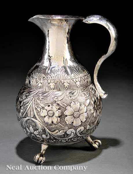 Appraisal: An Anglo-Indian Silver Pitcher unmarked hand-wrought raised pyriform body on