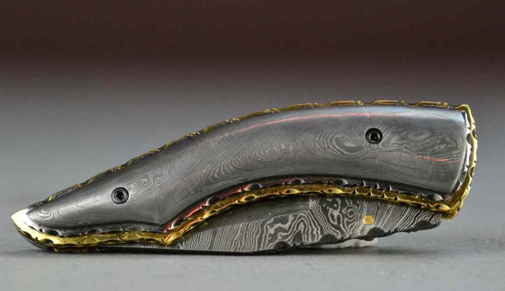 Appraisal: Damascus Blade Folding KnifeWith damascus blade and matching damascus curved