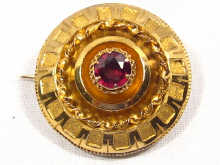 Appraisal: A carat gold and garnet circular Victorian brooch