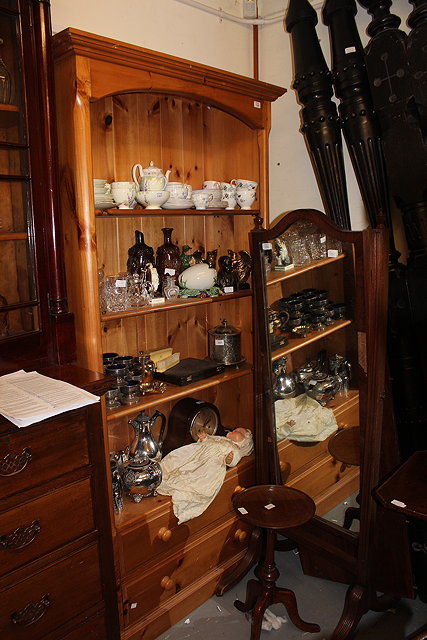 Appraisal: A PINE BOOKCASE with three adjustable shelves over two drawers