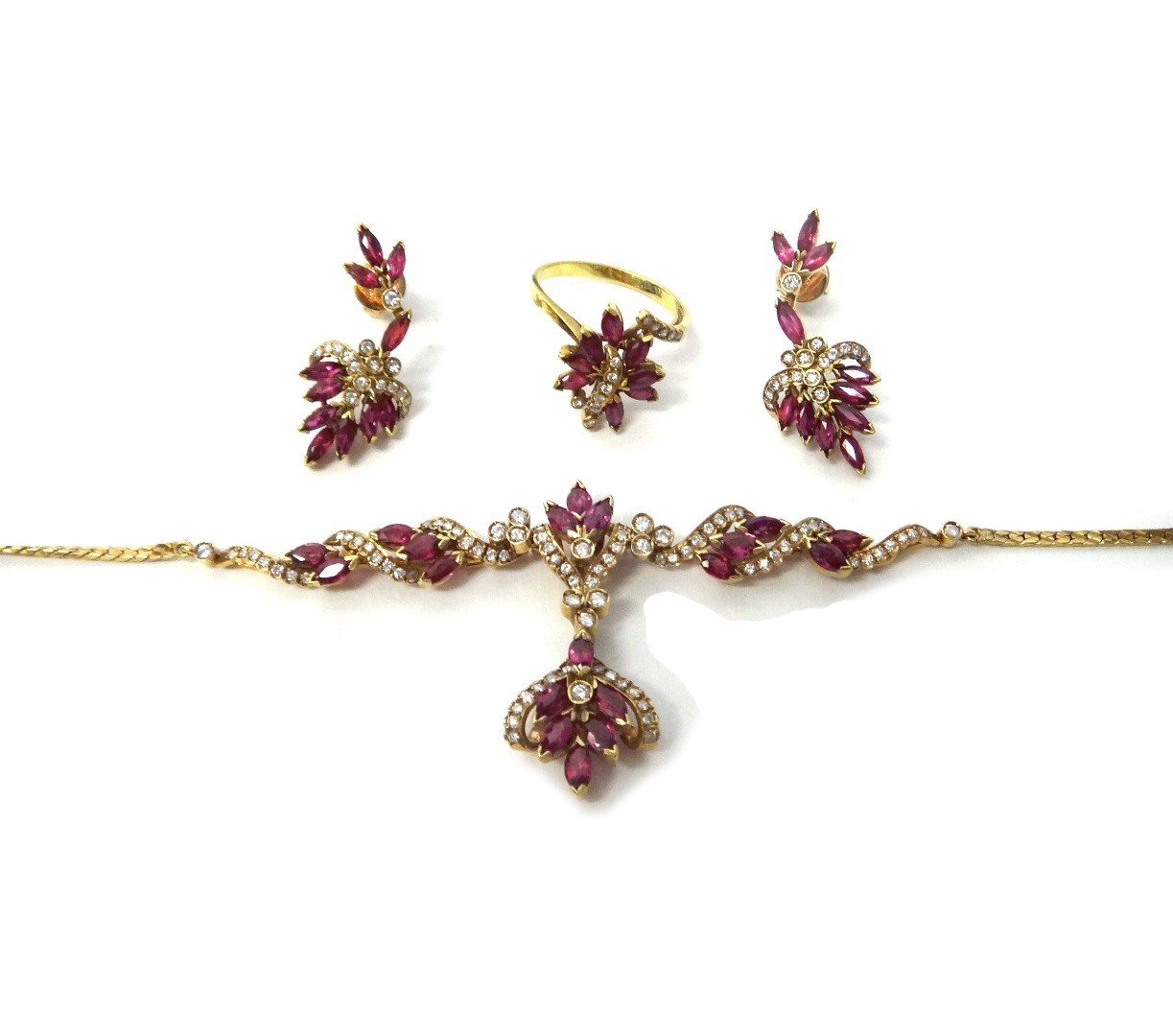 Appraisal: A gold ruby and diamond set pendant necklace in a