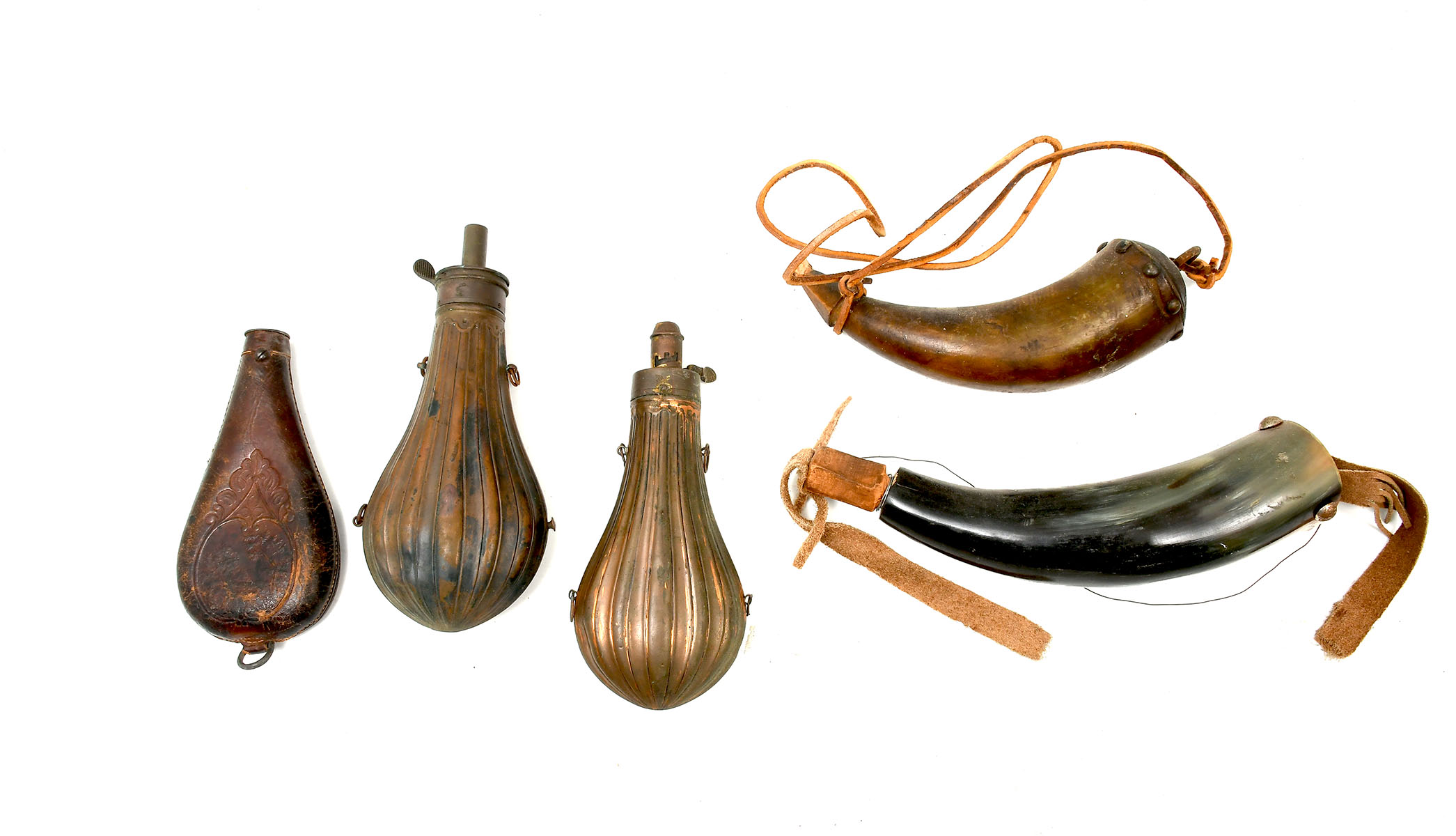 Appraisal: POWDER HORNS FLASKS Comprising - Antique copper powder horns -