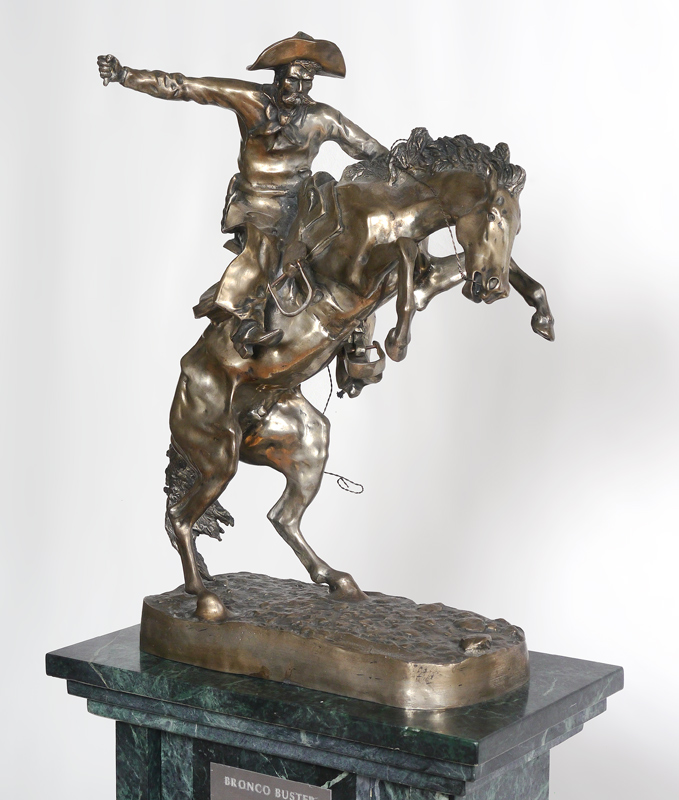 Appraisal: SILVER METAL SCULPTURE OF BRONCO BUSTER AFTER REMINGTON W CUSTOM