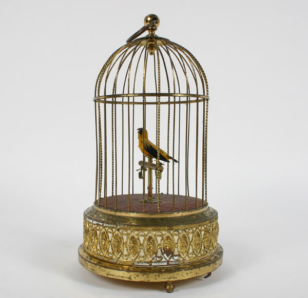 Appraisal: German singing bird automaton brass cage bird with genuine plumage