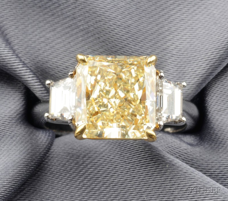 Appraisal: Fancy Yellow Diamond and Diamond Solitaire prong-set with a radiant-cut