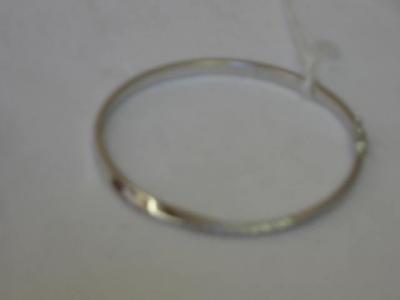 Appraisal: AN CT WHITE GOLD BANGLE set with approximately eighteen small