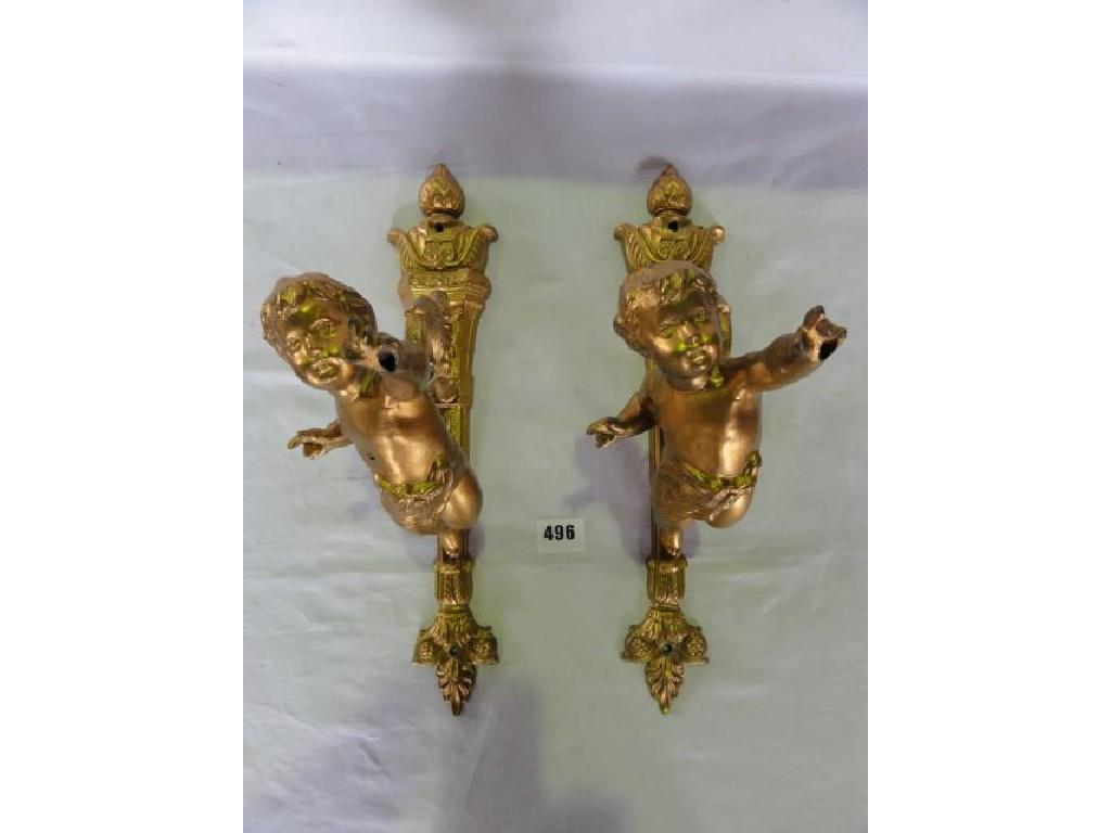 Appraisal: A pair of brass wall brackets in the form of