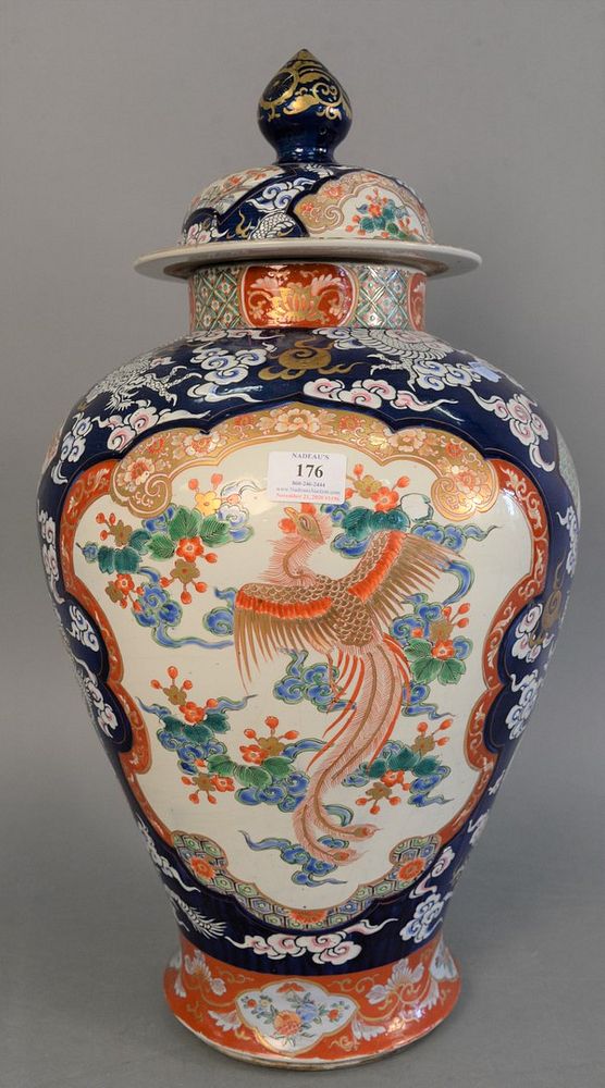 Appraisal: Large Chinese porcelain urn cover over painted three claw dragon