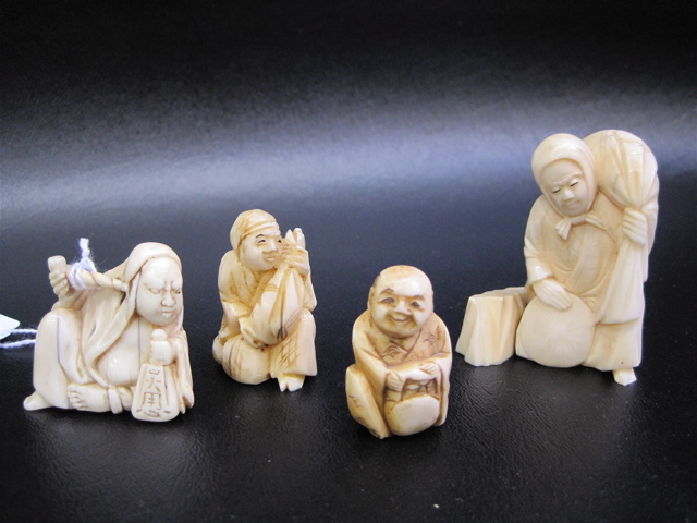 Appraisal: THREE IVORY CARVED JAPANESE NETSUKE AND SMALL CARVING of a