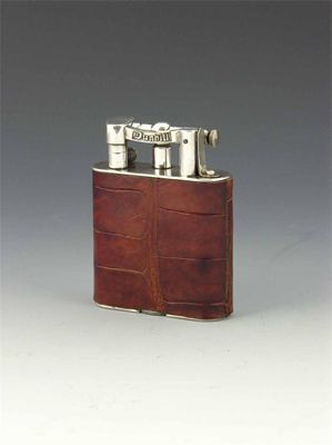 Appraisal: A Dunhill crocodile 'Giant' table lighter with plated mounts the