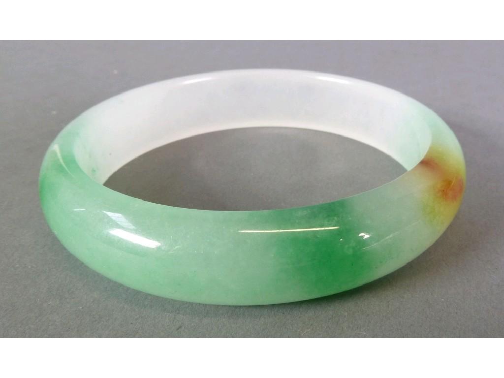 Appraisal: GREEN BROWN AND WHITE JADE BANGLE wide EST -