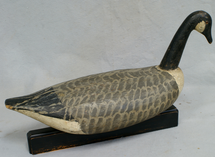 Appraisal: Carved and painted roothead goose decoy wrought iron keel weight