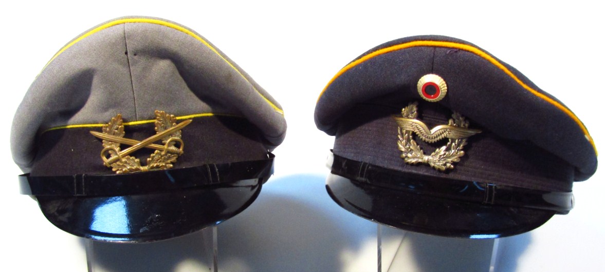 Appraisal: Two modern German officer's caps each with yellow trim one