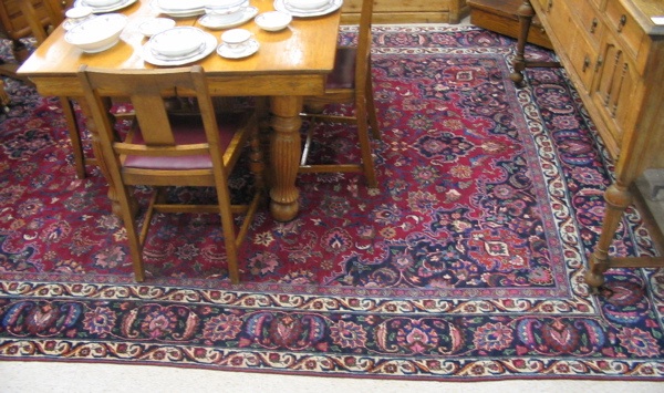 Appraisal: PERSIAN MASHAD CARPET hand knotted in a floral and floral