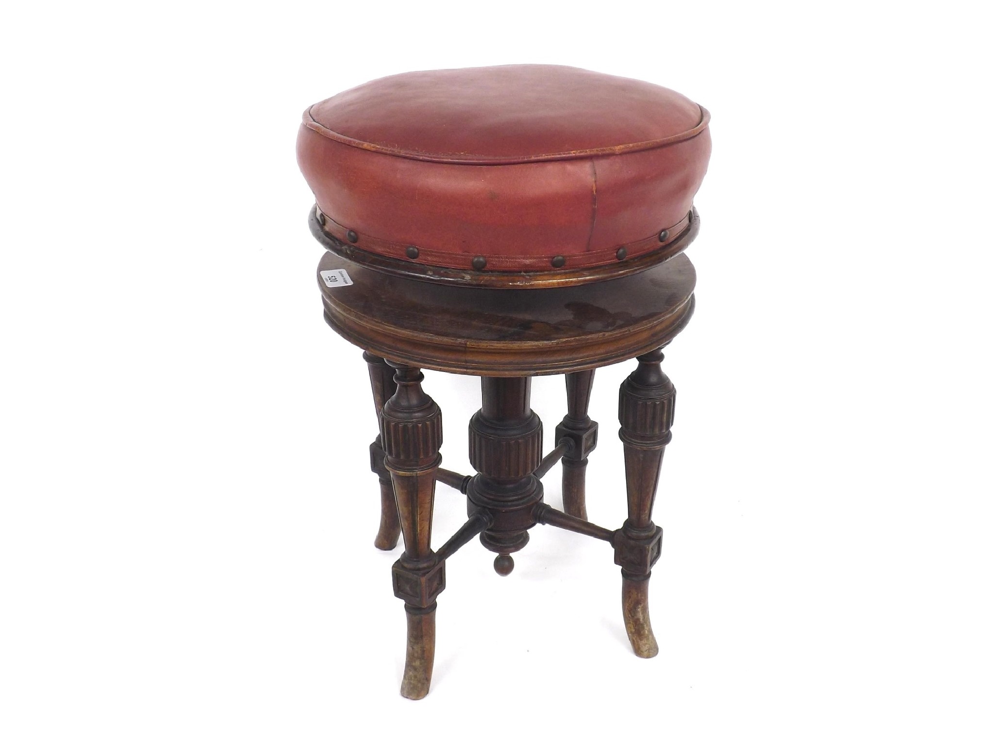 Appraisal: th century rosewood piano stool with red leather stuffover seat