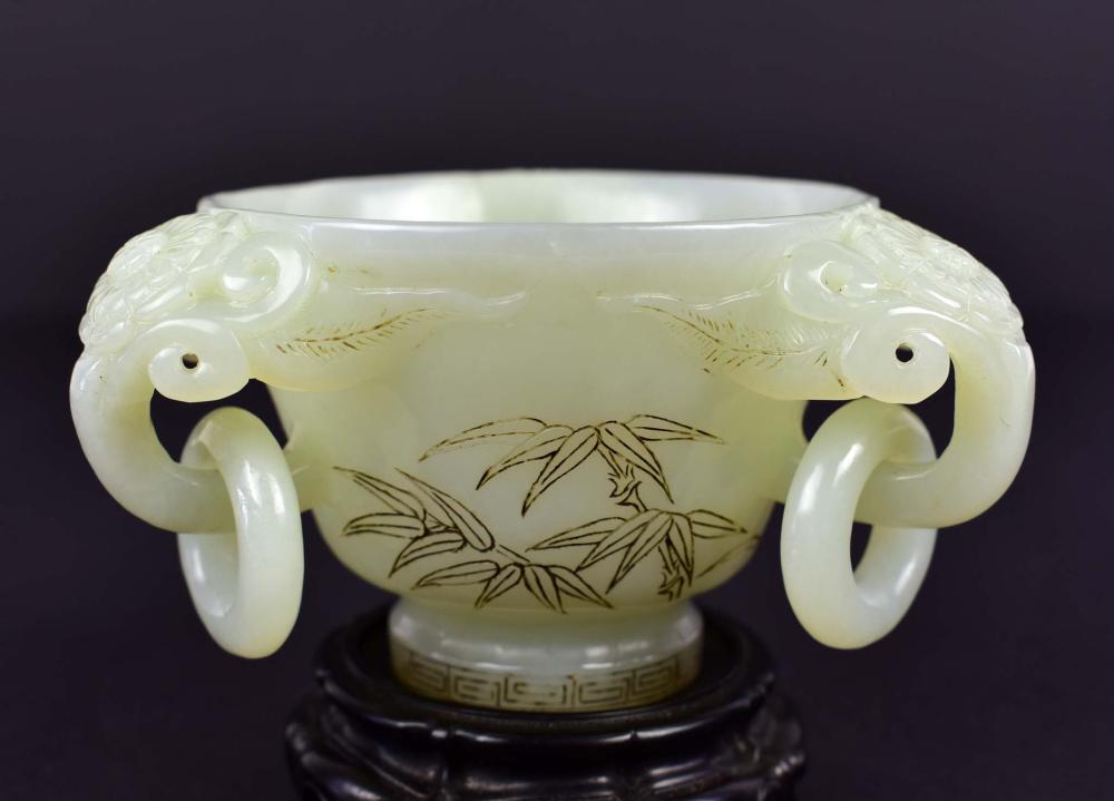 Appraisal: CHINESE PALE CELADON JADE CUPThe circular tapering cup with three