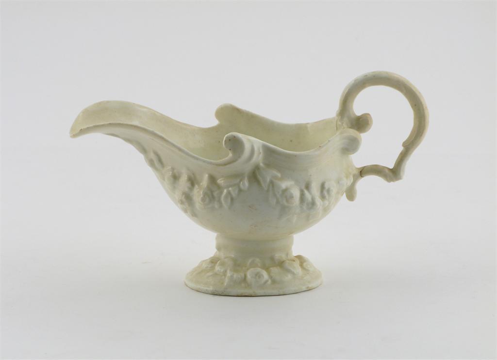 Appraisal: An early Bow white-glazed sauceboat