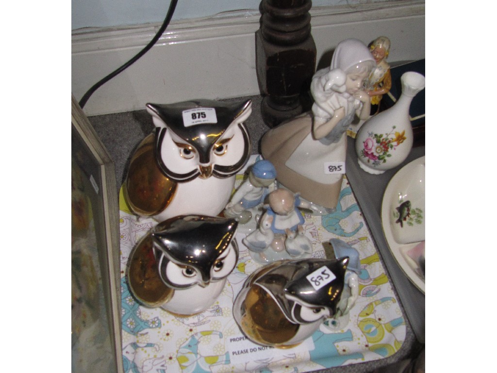 Appraisal: Set of three graduated owl figures and four assorted figure