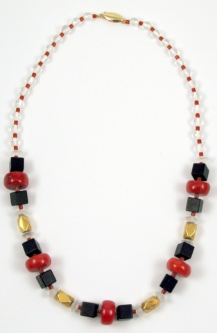 Appraisal: BLOOD CORAL AND BLACK ONYX NECKLACE in length and strung