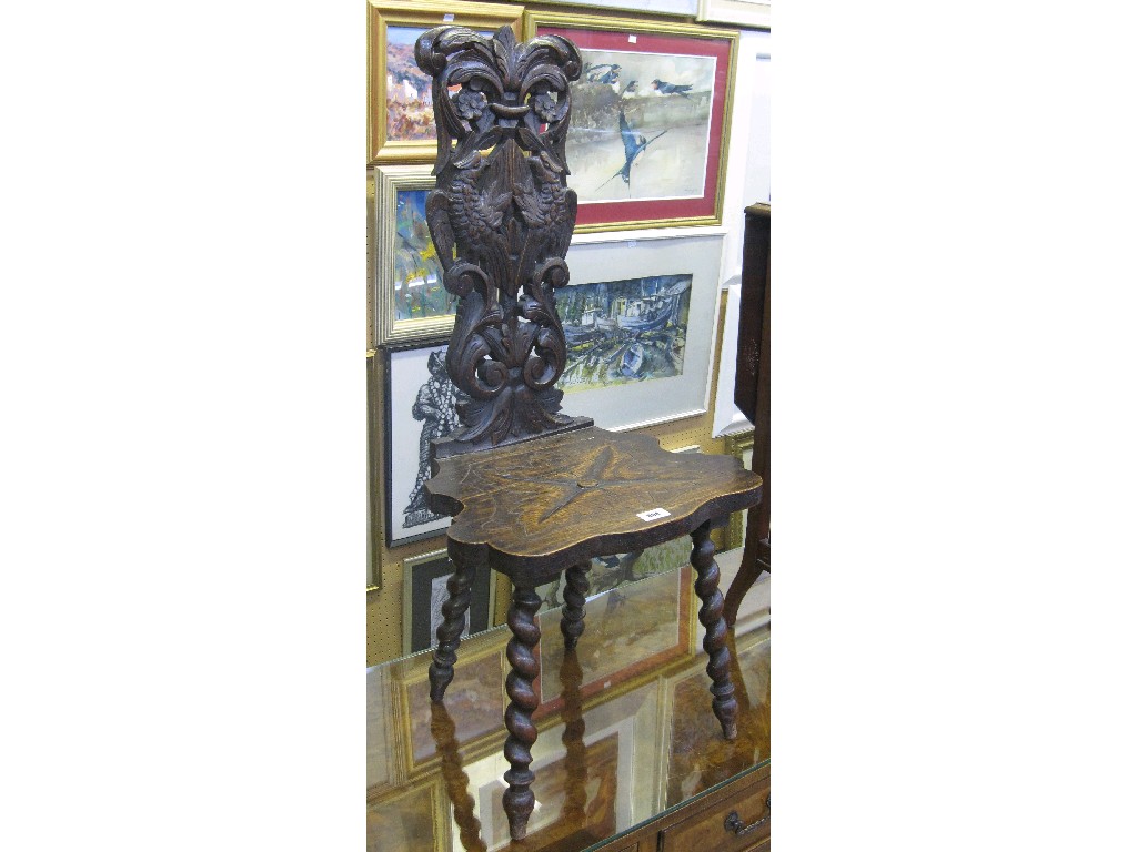 Appraisal: Carved oak hall chair on barley twist supports