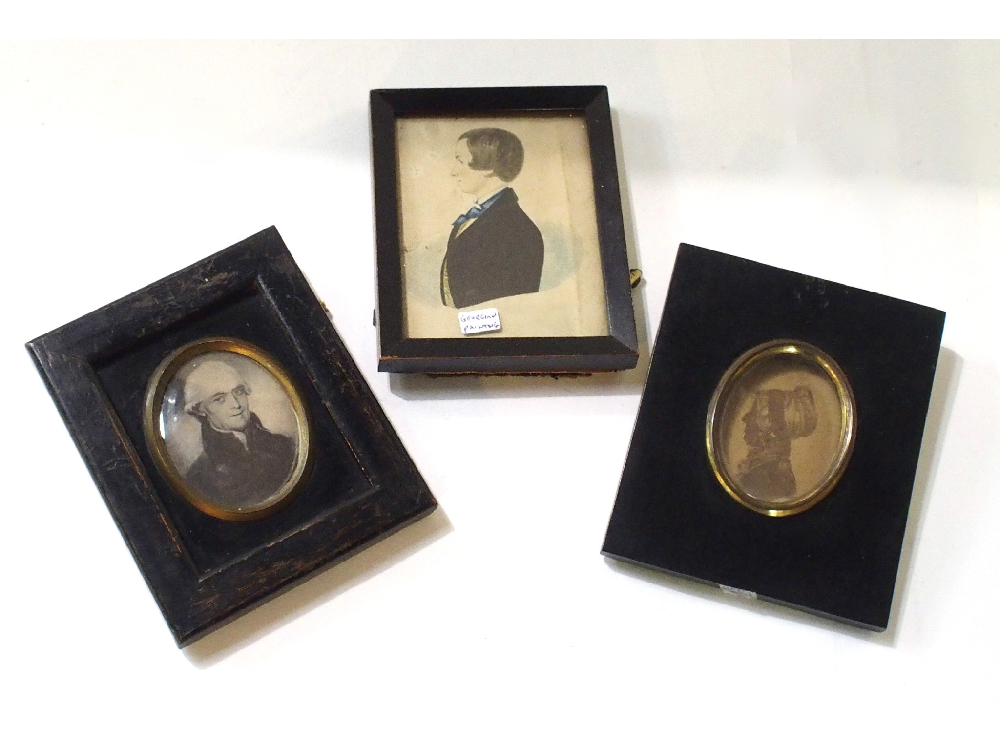 Appraisal: A lot comprising a framed portrait miniature and two silhouettes