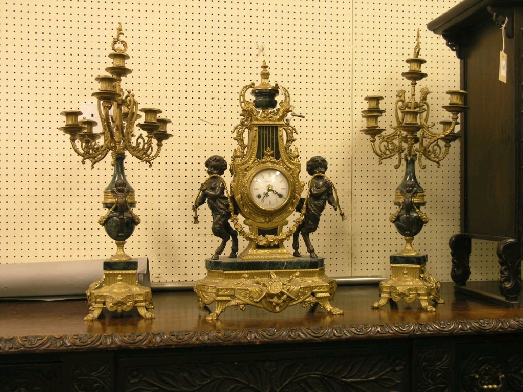 Appraisal: A Louis XV-style 'ormolu' and marble clock garniture the clock