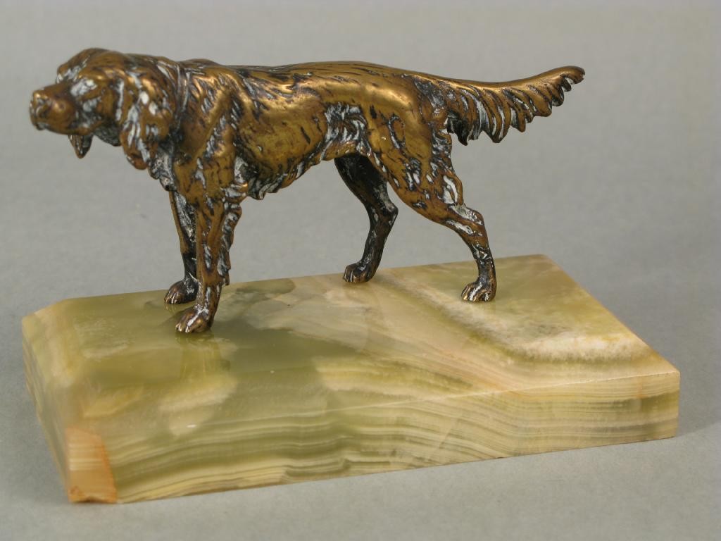 Appraisal: A polished bronze model of a dog now on onyx