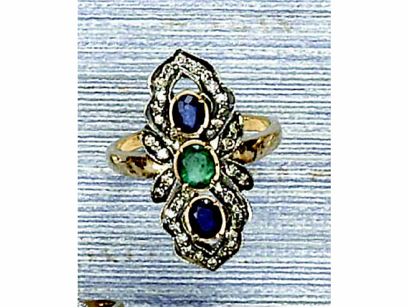 Appraisal: GEMSTONE RING Silver over gold lady's ring set with one