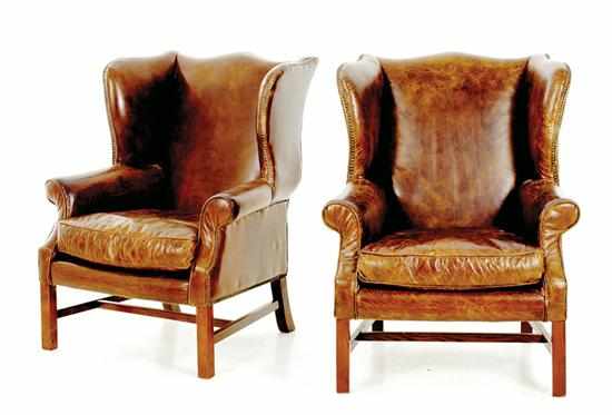 Appraisal: Pair leather wingback armchairs in the Chippendale style with shaped