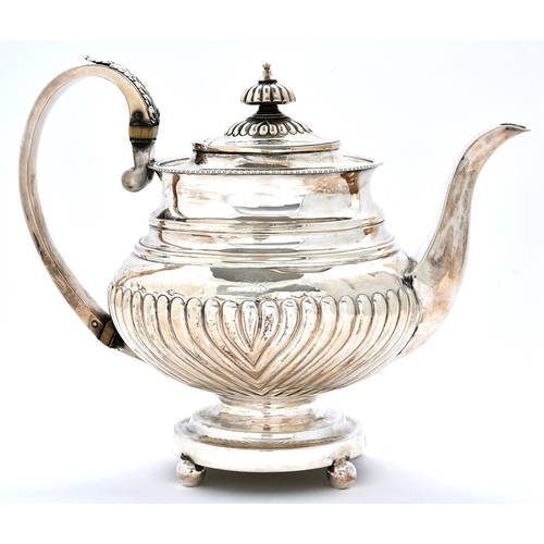 Appraisal: A George IV silver teapot spirally reeded crested cm h