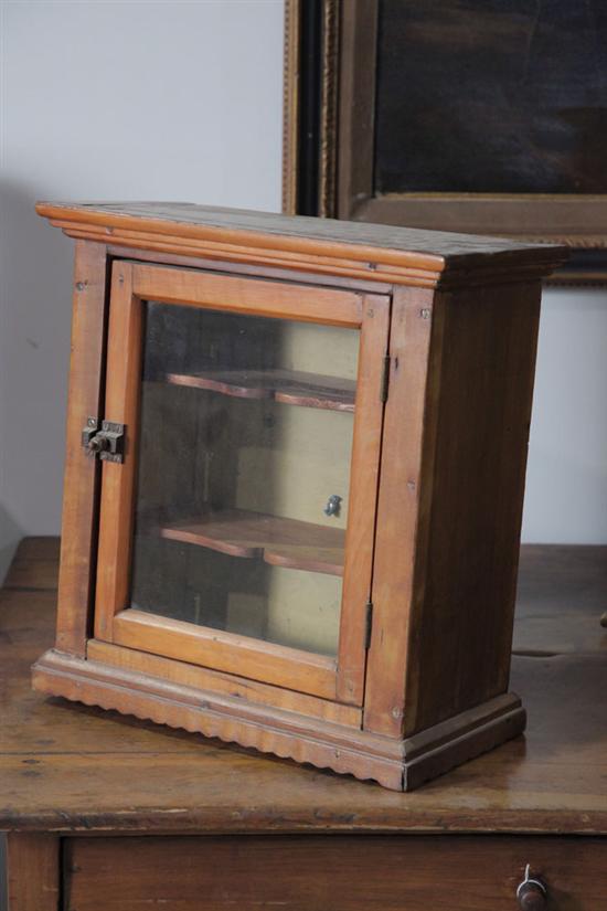 Appraisal: HANGING CABINET Pine having a glazed door and brass latch