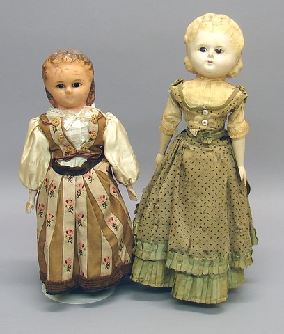 Appraisal: Pair of wax over papier mache dolls with molded hair