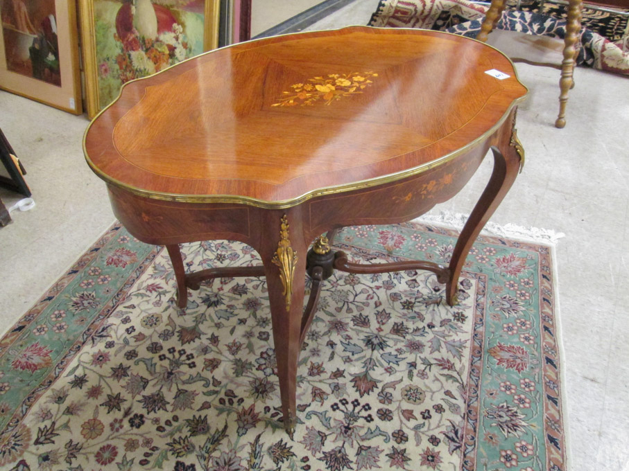 Appraisal: LOUIS XV STYLE INLAID AND ORMOLU-MOUNTED ROSEWOOD CENTER TABLE French