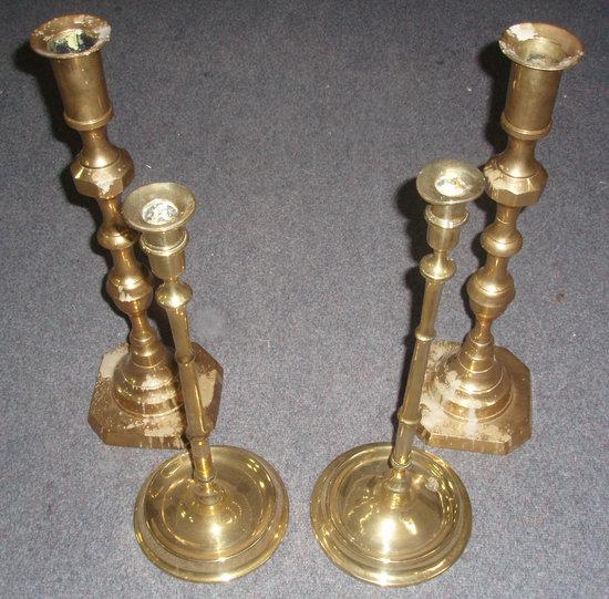 Appraisal: A pair brass candlesticks of slender ring turned form on