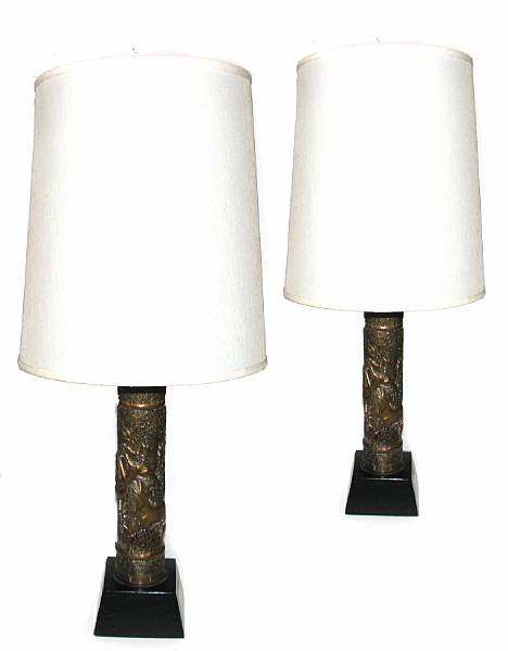 Appraisal: A pair of brass Trench Art table lamps with repousse