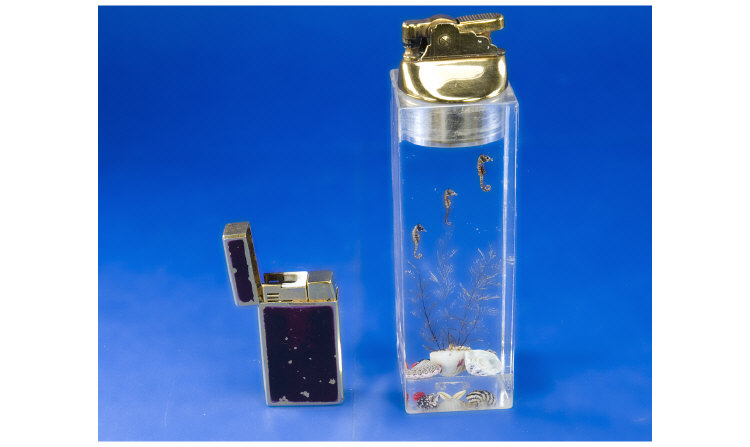 Appraisal: Table Cigarette Lighter United USA with Perspex Base containing Seahorses