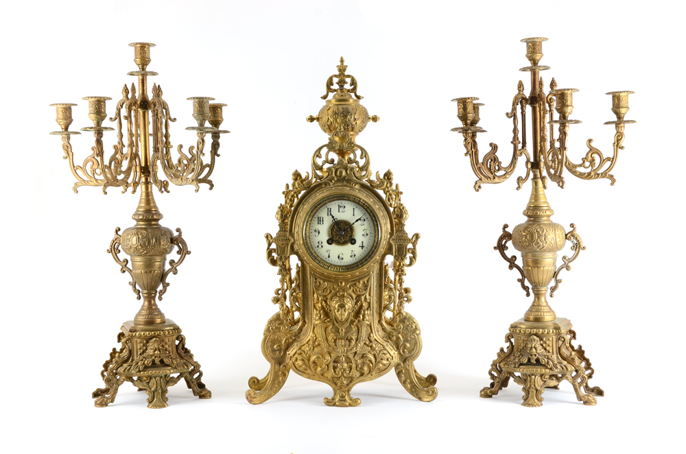 Appraisal: FRENCH BRASS CLOCK GARNITURE SET Heavy cast brass case with