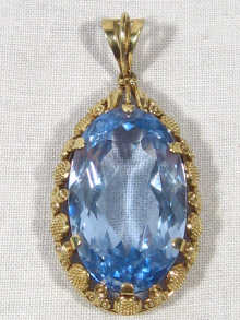 Appraisal: A carat gold pendant set with a blue stone