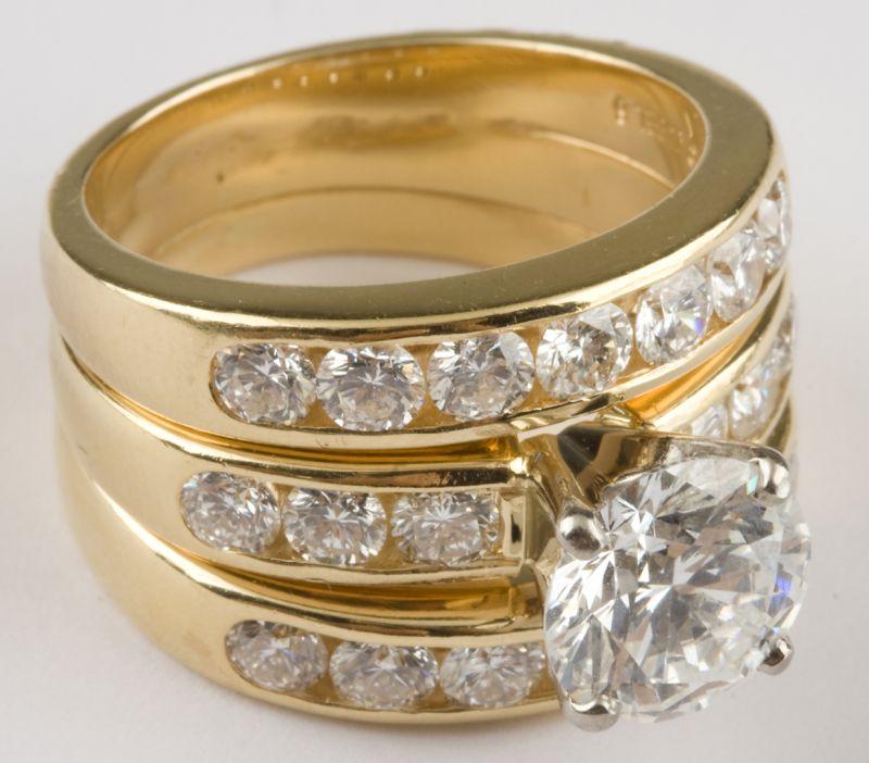 Appraisal: KT Yellow Gold Lady's Three Ring Wedding Set one prong