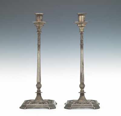 Appraisal: A Pair of Oscar Bach Candlesticks A tall pair of